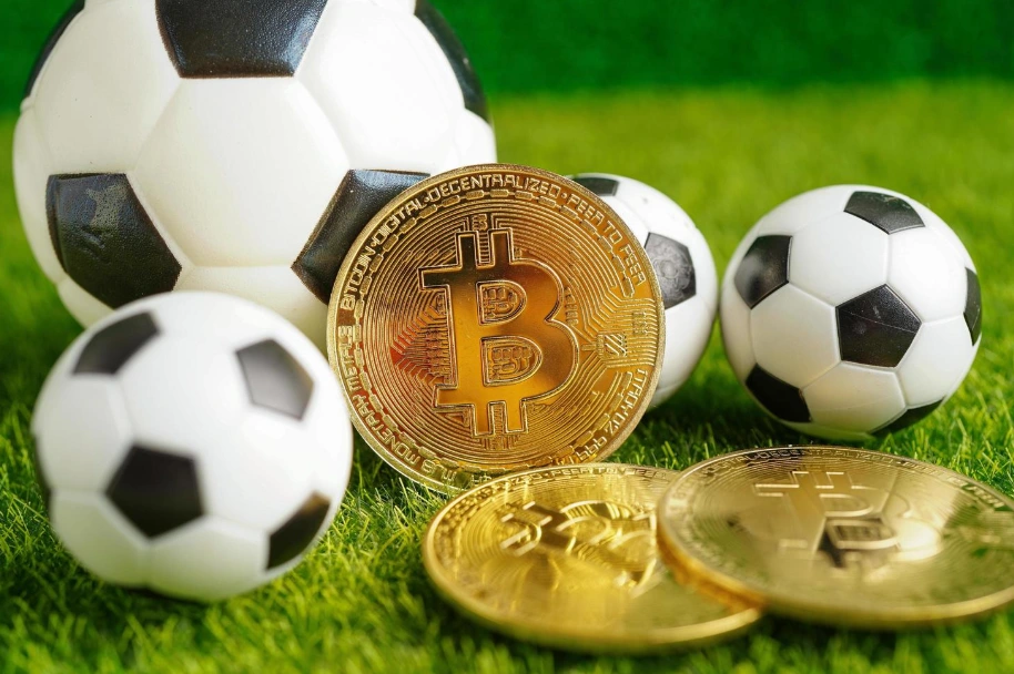Gold bitcoin with soccer ball or football cryptocurrency used in online sports betting